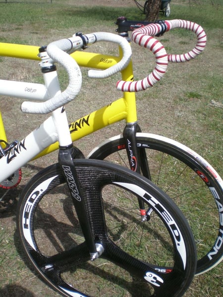 yellow and white zinn track bikes