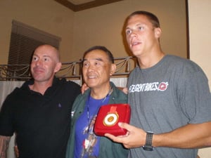 Jack Hsieh (center, who runs the KHS/Free Agent bike factory in Taiwan), with Olympic BMX gold medalist Maris Stromberg (r.) and his team manager.