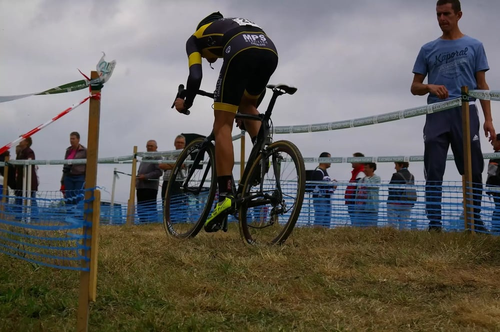 Man racing on a cyclocross course